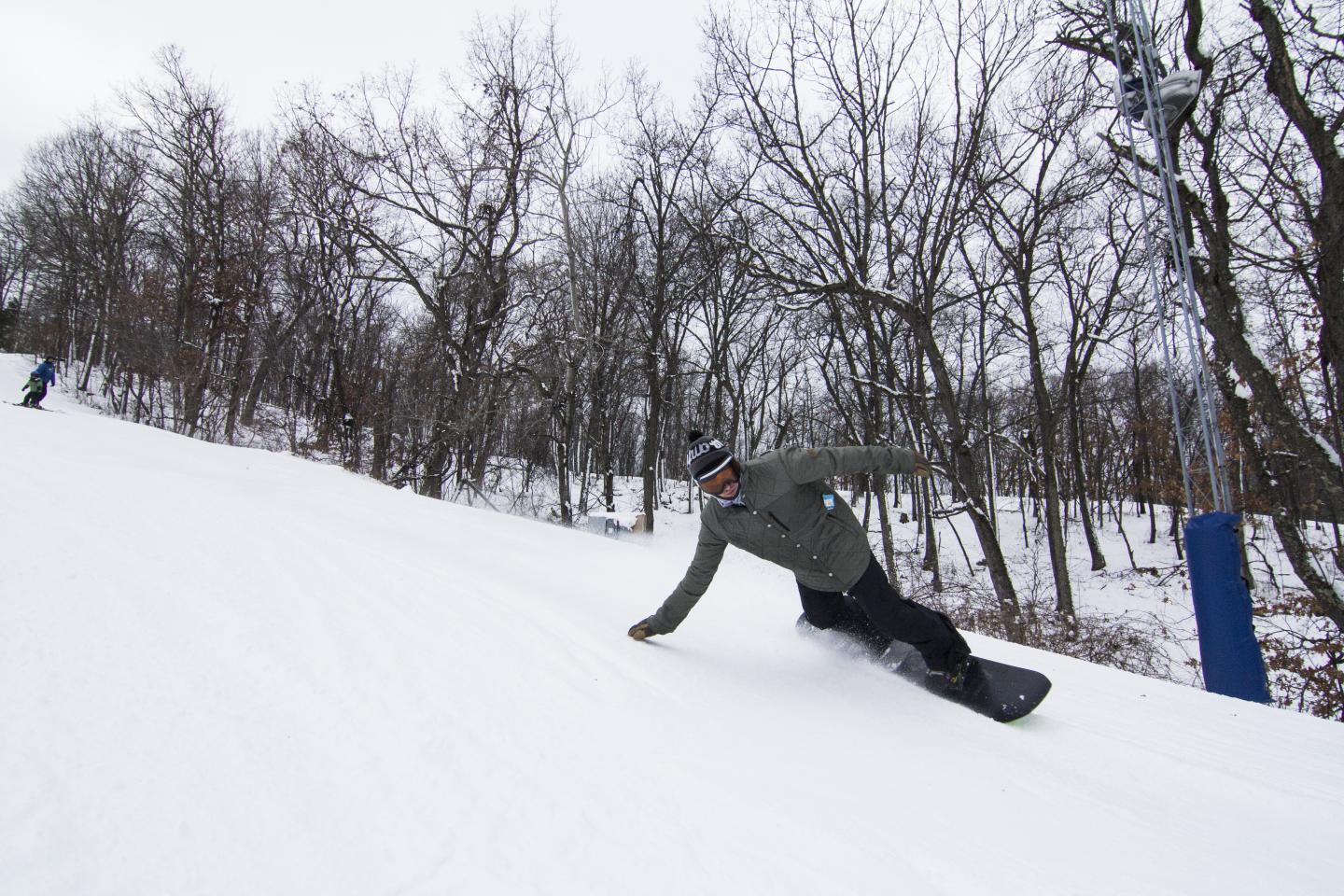 snowboarder turning down hill